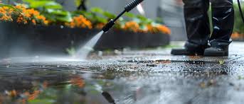 Professional soft washing equipment being used on house exterior